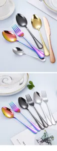 Stainless steel flatware set detail showing colorful spoons, forks, and knives for western dining.