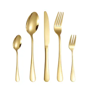 Gold stainless steel flatware set of five pieces, including knife, fork and spoon for western dining.