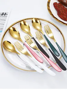 Gold stainless steel cutlery set with colorful handles, elegant spoon and fork for dining table.