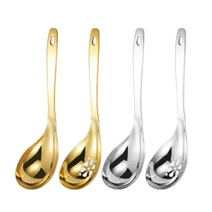 Stainless steel soup spoon and colander set, gold and silver kitchenware, home cooking tools.