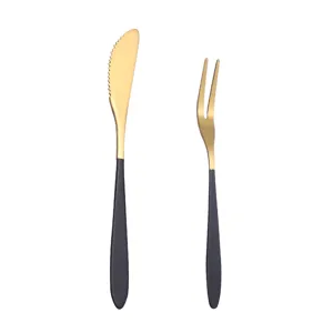Stainless steel tableware set with gold blade and black handle, modern design for fruit and dessert.