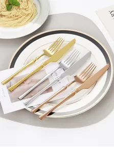 Close-up detail of stainless steel flatware set featuring exquisite waist design and polished finish.