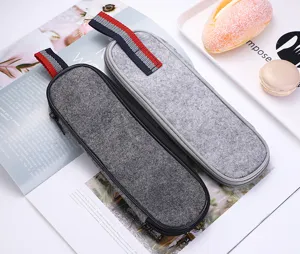 Grey felt portable storage bag detail shot, displaying zipper closure and hanging loop.