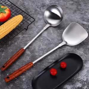Stainless steel kitchenware set with wood handle, including soup ladle and cooking spatula.
