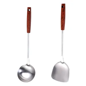 Stainless steel kitchen utensil set with wooden handle spatula and soup ladle for cooking.