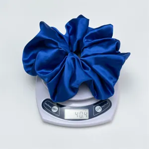 Blue satin scrunchie for women, large elastic hair band, elegant silk hair tie for daily wear.