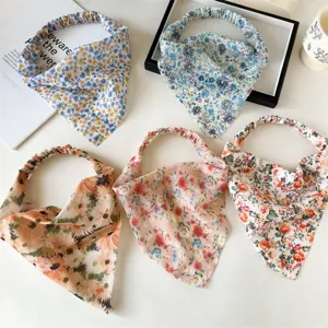 Floral chiffon hair scarf detail showing cute floral print and elastic band design for women.