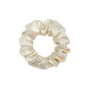 Elegant champagne satin hair scrunchie for women, soft silk-like ponytail holder daily use.