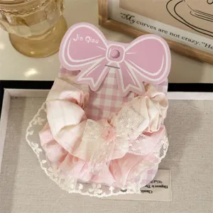 Detailed view of the sweet pink plaid hair scrunchie with delicate lace trim and cute bow.