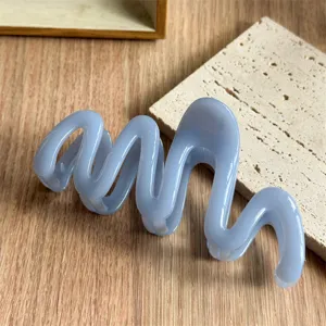 Light blue wave hair claw clip for women, stylish summer resin hair accessories for styling.