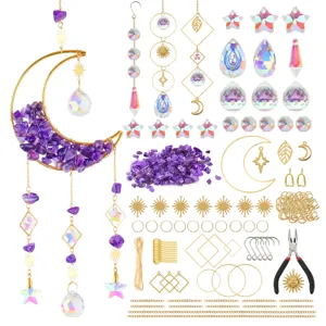 Crystal suncatcher DIY material kit with prism pendants, metal charms, and purple stone chips.