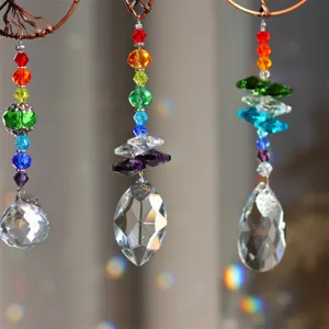 Crystal suncatcher detail, colorful beads and teardrop pendant refracting sunlight.