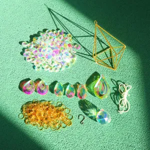 DIY crystal suncatcher making kit details, showing AB coated glass pendants, beads, gold rings