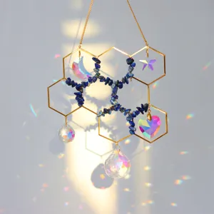 Honeycomb crystal suncatcher hanging ornament featuring lapis lazuli chips and rainbow pendants.
