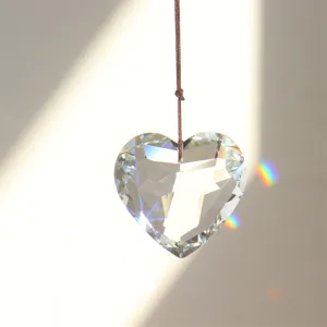 Crystal heart suncatcher pendant crystal detail shot showing prismatic light refraction.