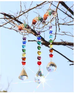 Crystal suncatcher detail shot featuring colorful tree of life hanging crystal pendant decor.