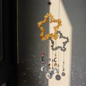 Handmade citrine crystal star suncatcher wind chime with prism balls and moon pendants for home.