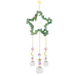 Crystal suncatcher detail featuring a green aventurine star frame and crystal balls.