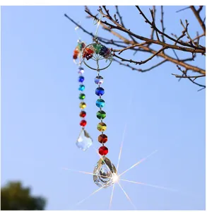 Crystal suncatcher detail showing the tree of life design, colorful beads and crystal pendant.