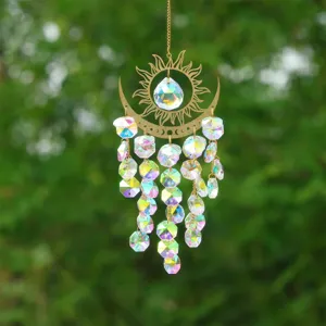 Crystal suncatcher pendant with golden sun moon metal frame and rainbow prisms for home decor.