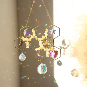Honeycomb suncatcher with natural crystal chips and rainbow light reflection pendants.