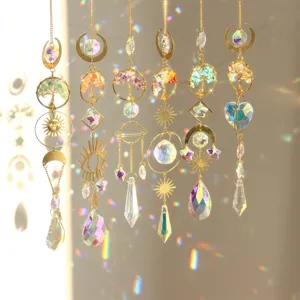 Hanging crystal suncatcher with golden tree of life and prisms, glowing rainbow window decor.