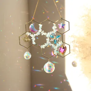 Close-up details of the honeycomb crystal suncatcher featuring rainbow glass pendants and chips.