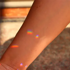 Crystal suncatcher light and shadow effect detail shot, beautiful rainbow prism reflection.