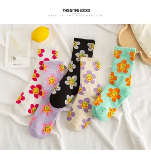 Cute cotton mid-tube socks featuring colorful smiley flower patterns. Comfortable and stylish.