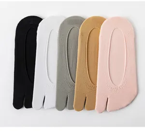 Close-up detail of women's comfortable cotton split toe invisible low-cut socks in multi colors.