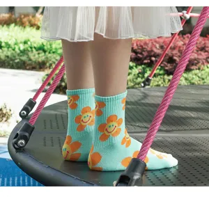 Cute smiley flower printed cotton mid-tube women socks, trendy casual hosiery.