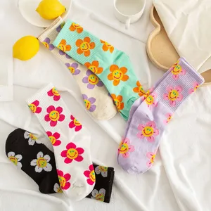 Colorful cartoon smiley flower cotton mid tube women socks for daily casual wear.