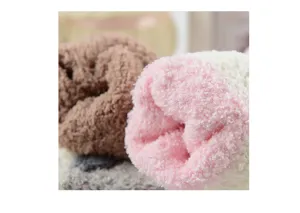 Soft plush detail of winter home floor socks, cozy coral fleece material for warm indoor wear.