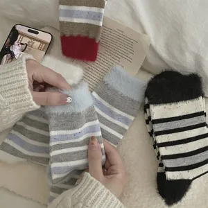 Cozy fuzzy striped mid-calf socks for women, winter thick soft plush cute casual hosiery.