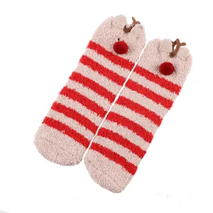 Cute Christmas plush floor socks with red white stripes and reindeer ears for warm indoor wear.