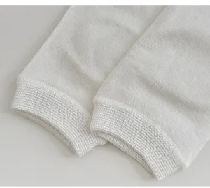 Detail view of women silk slouch socks showing fine knit rib cuff texture for summer wear.