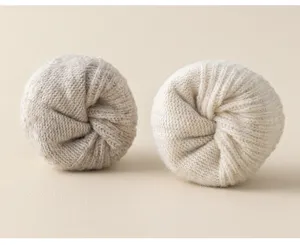 Cozy thick wool blend winter sleep socks rolled in neat pairs, soft and warm thermal design.