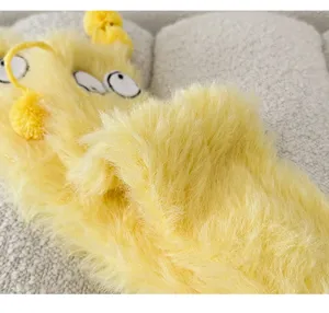 Cute yellow plush fuzzy long socks detail view, warm coral fleece sleep floor socks for winter.