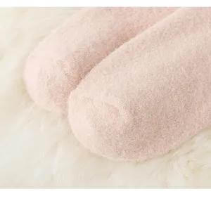 Soft cozy fluffy winter warm plush sleep fuzzy socks close-up detail view for women.