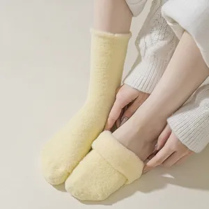 Women fuzzy winter warm thick plush fleece home floor socks in soft yellow color.