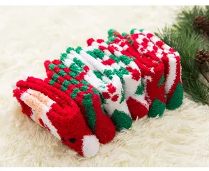 Detailed close-up view of fluffy thick winter Christmas socks in assorted red and green festive styles.