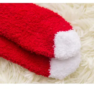 Cozy red white fuzzy Christmas socks detail view soft warm plush winter sleep socks.
