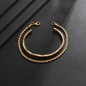Gold two-piece bracelet set detail featuring open cuff and rope chain for daily wear.