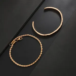 Gold finish open cuff and twisted rope chain bracelets set close-up product detail view.
