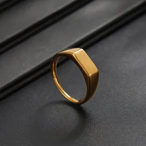 Close-up detail of the gold stainless steel square signet ring featuring a polished finish.