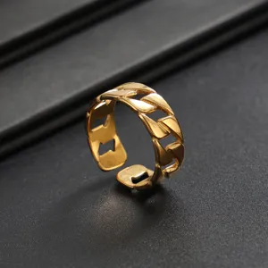 Detail view of stylish gold stainless steel chain ring for men, adjustable open band.
