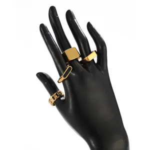 Detailed view of the luxury gold stainless steel open ring set, featuring geometric designs.