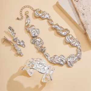 Silver irregular liquid metal necklace, earrings, and bracelet jewelry set for women.