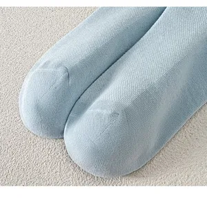Light blue cotton socks detail close-up, soft breathable mesh knit texture, summer daily wear.