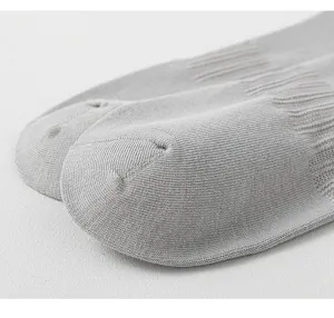 Detail shot of grey cotton men socks showing fine knit texture and breathable mesh toe design.